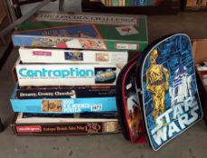 A quantity of jigsaws, games & 2 Star Wars backpacks