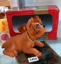 A boxed vintage nodding dog