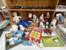 A quantity of Snoopy annuals & Soft toys