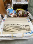A boxed Commodore Amiga 500 with accessories & games. Believed to be working, SOLD AS SEEN