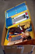 A suitcase / wardrobe including 3 Sindy dolls