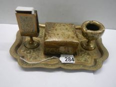 A vintage brass smoker's tray.