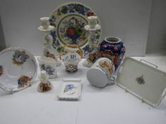 A mixed lot of ceramics including commemorative, Mason's, candlesticks etc.,