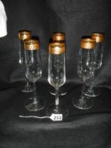 A set of six champagne flutes.