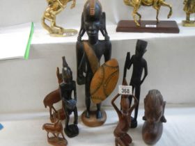 A mixed lot of wooden figures etc.,