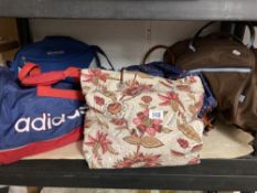 A V&A shopping bag, Adidas Sports bag and two others