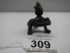 A small Indian bronze crawling baby (poss Indian Diety).
