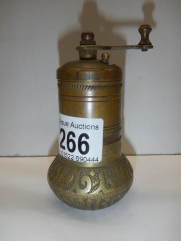 An old brass pepper grinder.
