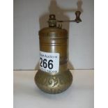 An old brass pepper grinder.