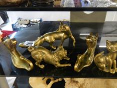 Five solid brass animals.