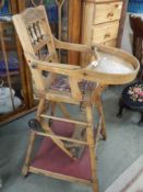 An early 20th century child's metamorphic high chair.