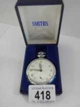 A cased Smith's pocket watch in need of attention.