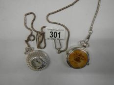 Two 20th century pocket watches on chains and in working order.
