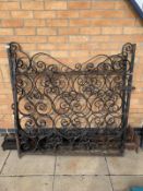 A Pair of wrought Iron gates with posts.