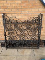 A Pair of wrought Iron gates with posts.