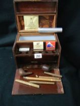 A mahogany smokers box with pipes and cigars etc.,