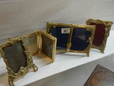 A quantity of brass photo frames.