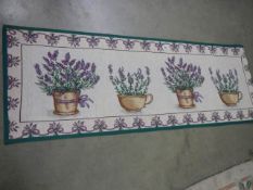 A tapestry featuring lavendar plants.