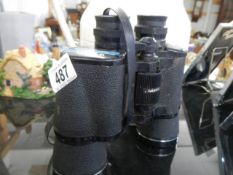 A pair of Tasco 12 x 50mm binoculars.