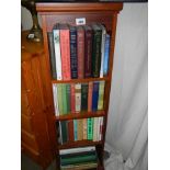 A mahogany book case and four shelves of books, COLLECT ONLY.