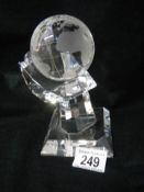 A superb quality crystal glass globe on rotating stand.