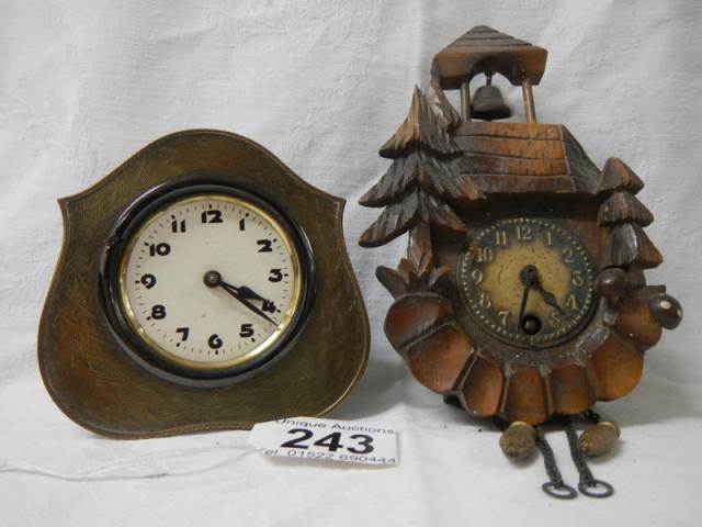 Two miniature mantel clocks.