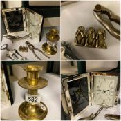 A Plated Clock and picture frame, Dolphine opener brass candle stick and misc other items