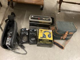 A Panasonic video camera, A radio, 2 way radios, & A Sanyo video camera