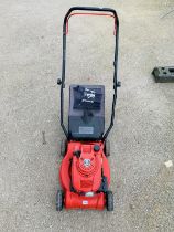 An Einhush petrol mower 450B4OP 148cc Briggs & Stratton engine. Needs attention