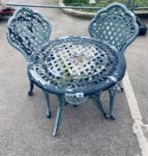 A Metal garden table with 2 chairs