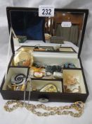 A jewellery box with assorted costume jewellery including cameo.