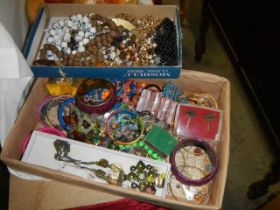 Two trays of assorted costume jewellery.