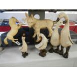 A quantity of duck figures.