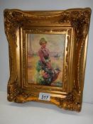 A gilt framed study of a lady with flowers.
