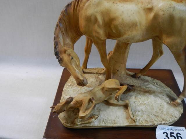 A horse and foal figure on base. - Image 2 of 2