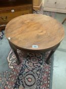 Small circular coffee table with claw effect feet