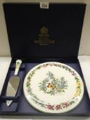 A boxed Royal Worcester porcelain cake plate with cake slice.