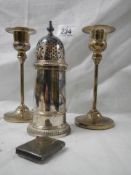 A pair of silver plate candlesticks, sugar sifter and match box.