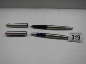 Two Parker fountain pens.