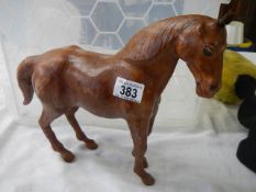 A leather horse figure.