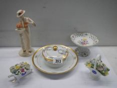 Five items of porcelain including butter dish, posies etc.,