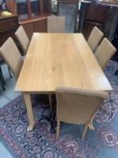 Dining table with 6 rattan effect chairs