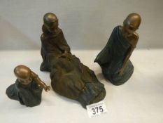 Three 'Soul' figures of African children.