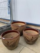 3 matching decorative plant pots