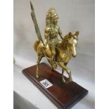 A solid brass American Indian on horse figure.