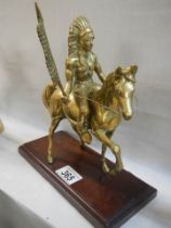 A solid brass American Indian on horse figure.