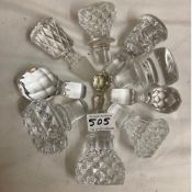 A collection of 10 cut glass decanter stoppers