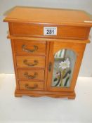 A good quality wooden jewellery cabinet.