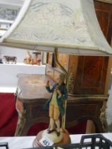 A figural table lamp.