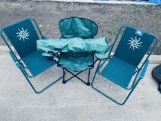 A set of 4 folding garden chairs in green.